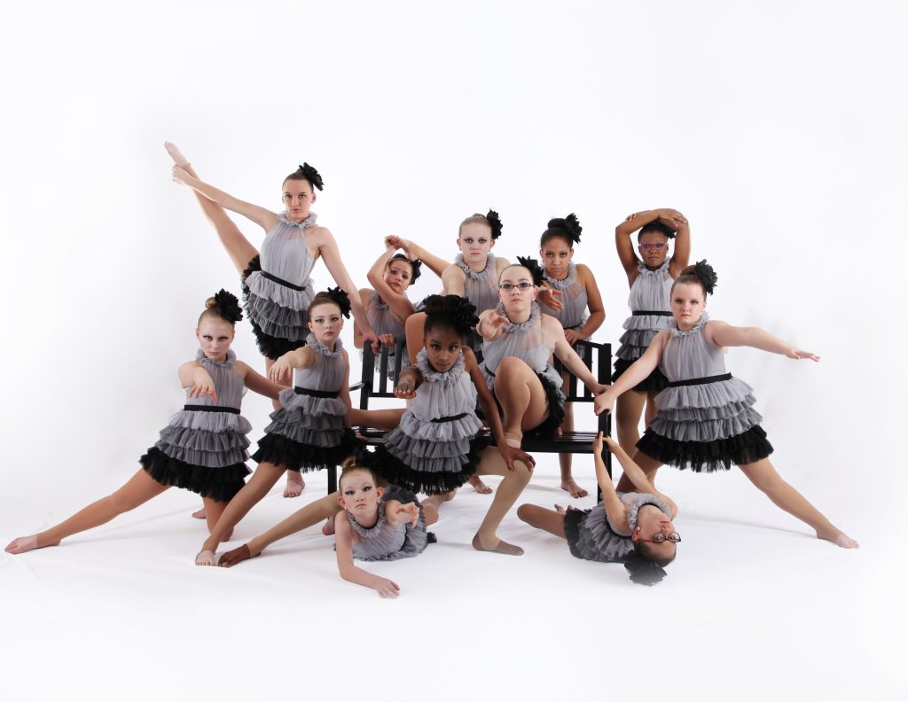 competitive lyrical dancer with a black bench