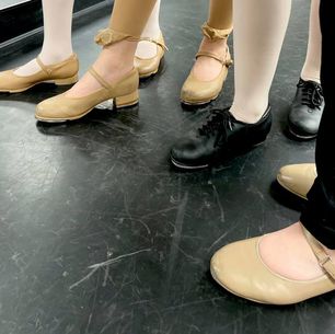 tap shoes on black Marley