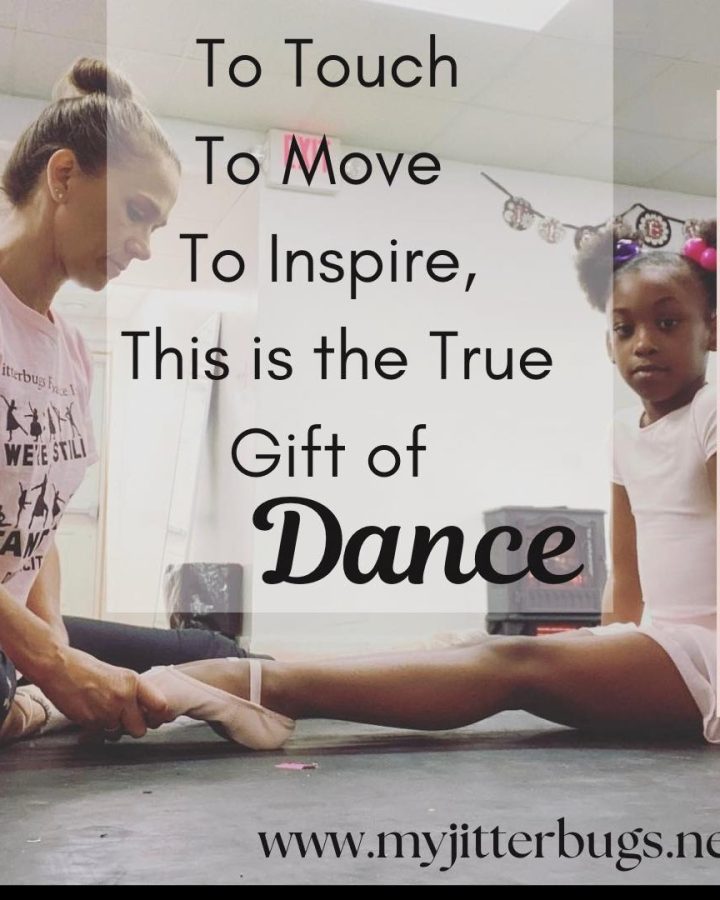 dance teacher fixing a small dancers feet