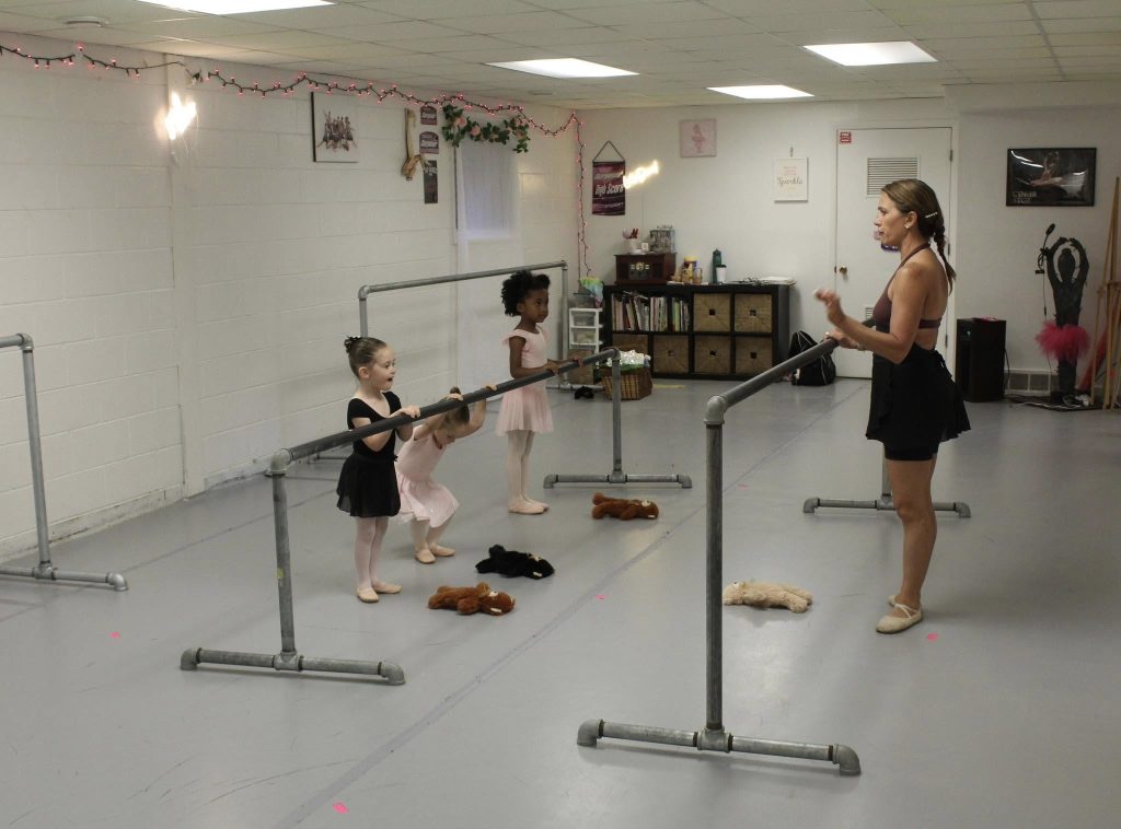 kids ballet class in belleville michigan at a ballet barre